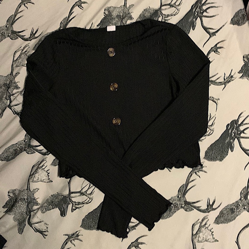 a black crop top with buttons
